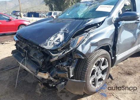 2019 Honda Cr-V Touring z USA, uszkodzony, nr VIN 7FARW2H90KE031598